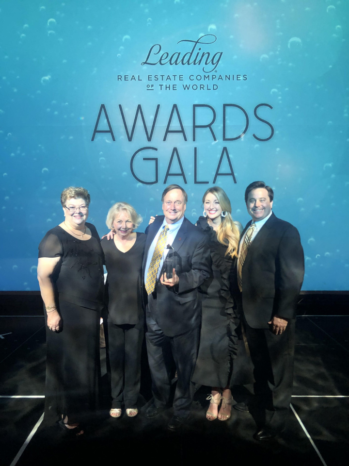 Glenn Gardner accepts the prestigious Leadership of the Year Award out of more than 565 firms across the globe. Pictured from left: Nancy Harmon, Sharon Gardner, Glenn Gardner, Crystal Gardner-Philips and Chip Gardner. 