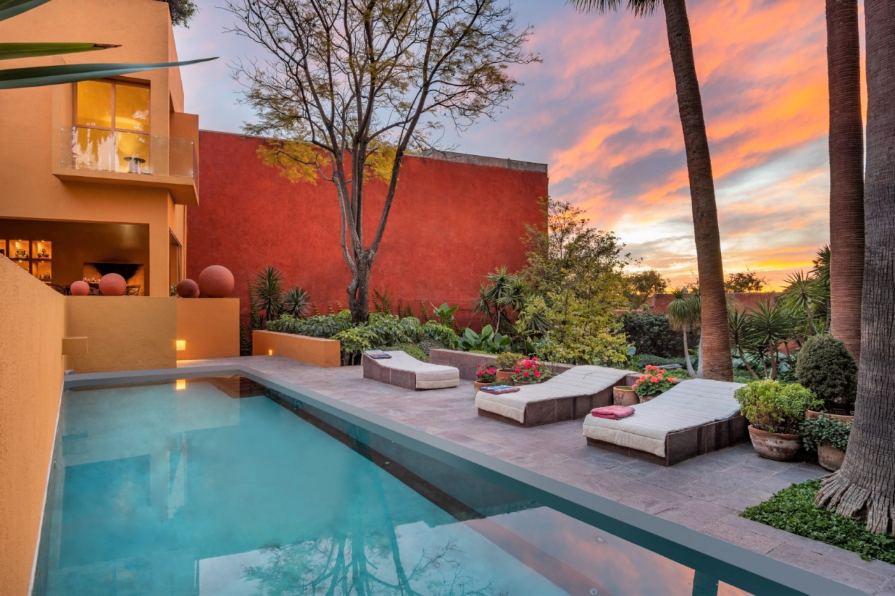 Casa Legorreta’s double lot affords this swimming pool and expansive gardens studded with palm trees.