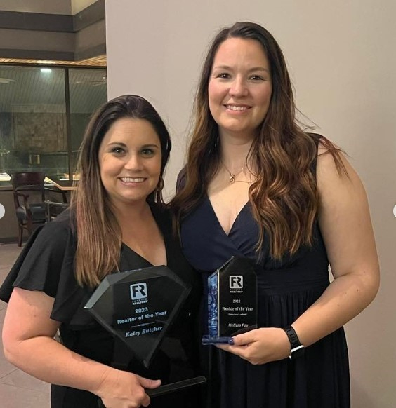 (Left to right) Harry Norman, REALTORS® agents Kaley Butcher and Melissa Pou awarded by the Fayette County Board of REALTORS®