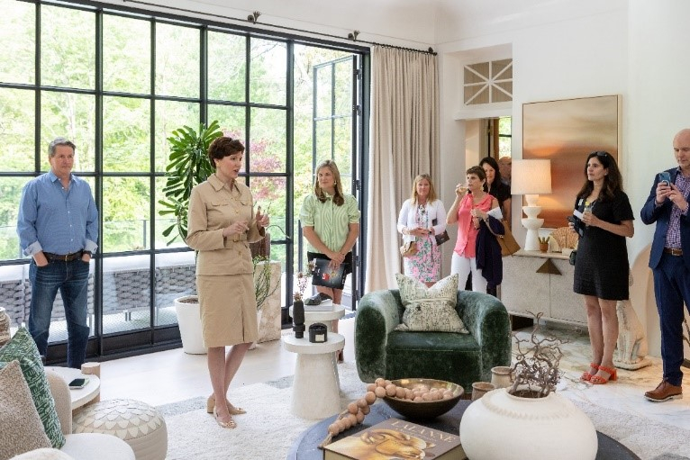 Jenni Bonura, Harry Norman, REALTORS® President and CEO gives opening remarks before guests tour the showhouse (Photo credit: CatMax Photography)