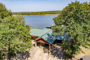 Escape to your own private lakeside oasis on over an acre lot.
