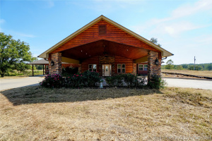 Beautiful entertaining home with 93 acres for farm or recreation.
