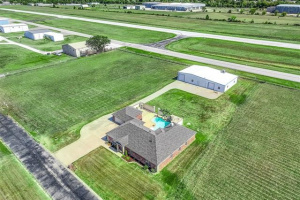 A beatutiful home, hanger w/ shop, & direct access to small town airport