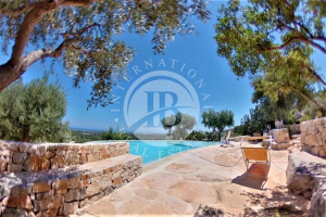 Complex of trulli and lamias with sea view, nestled in a terraced olive grove...