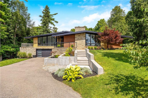 This architecturally designed, fully renovated mid-century modern bungalow!