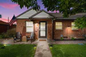 This Refined Residence, a charming brick haven nestled in Denver’s Athmar Park